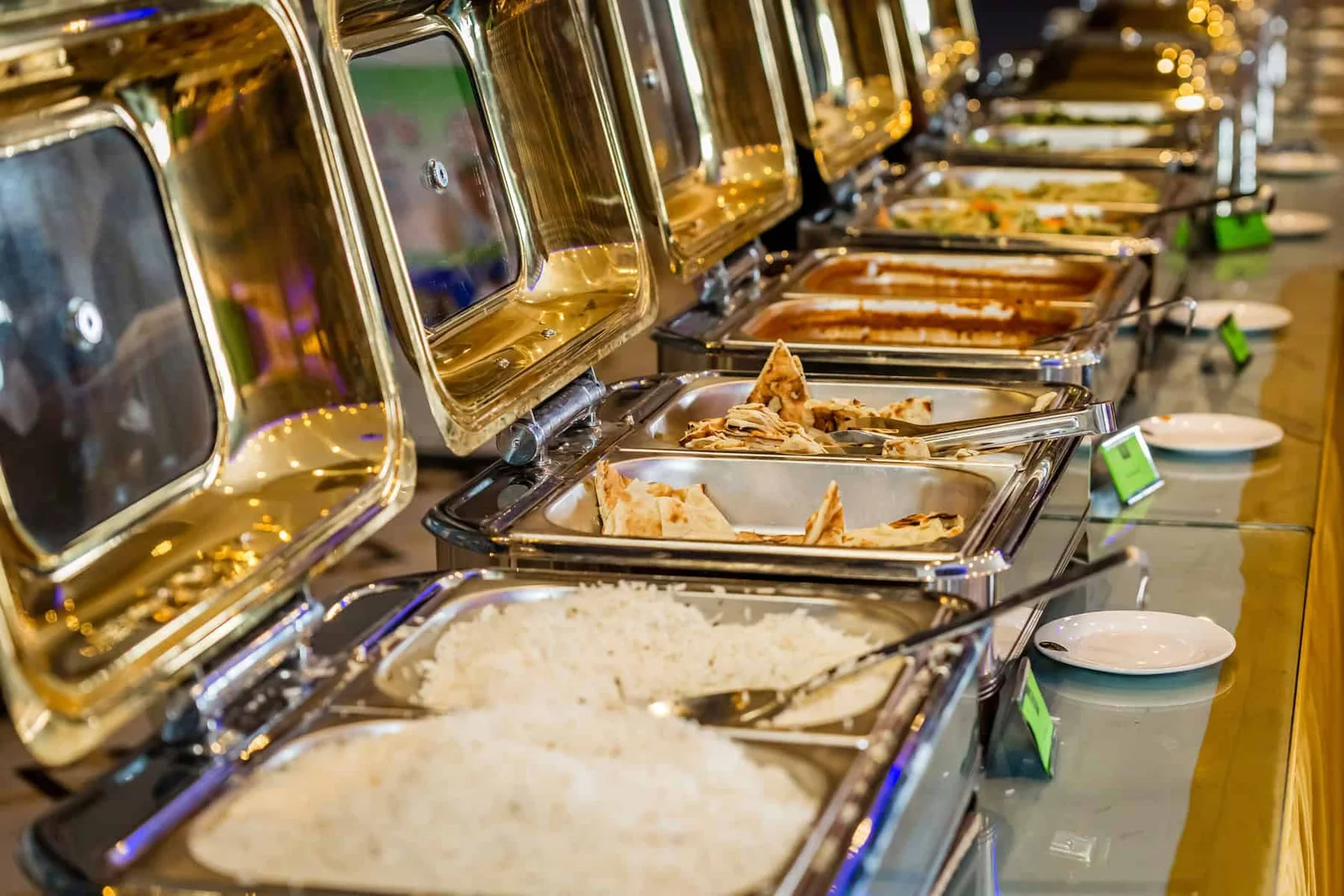 Buffet trays with rice, naan and Indian dishes